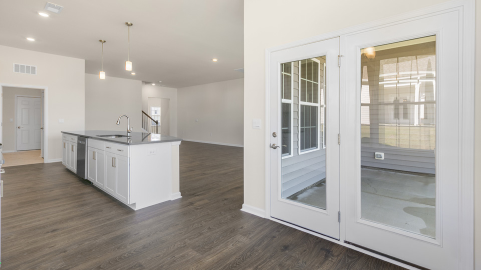 open concept dining space with sliding glass door to patio