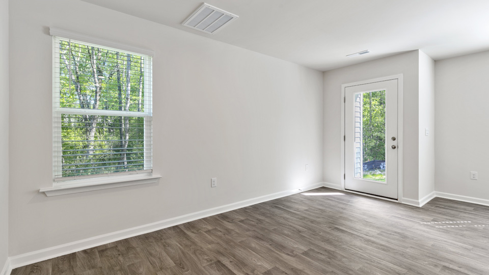 open concept dining space with door to patio