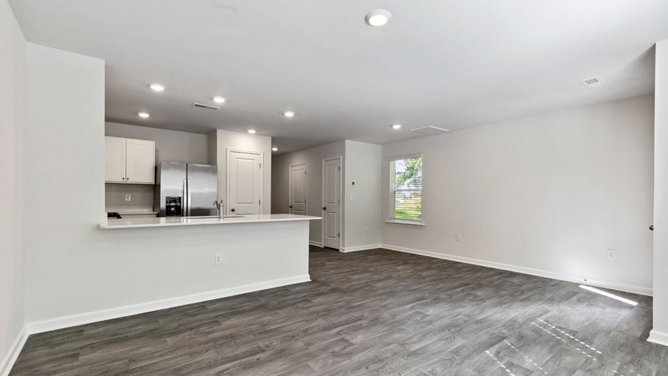 open concept living space with large windows
