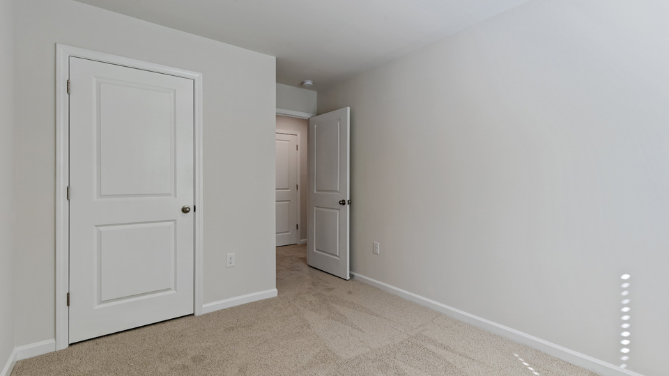additional bedroom with window, carpeting, closet