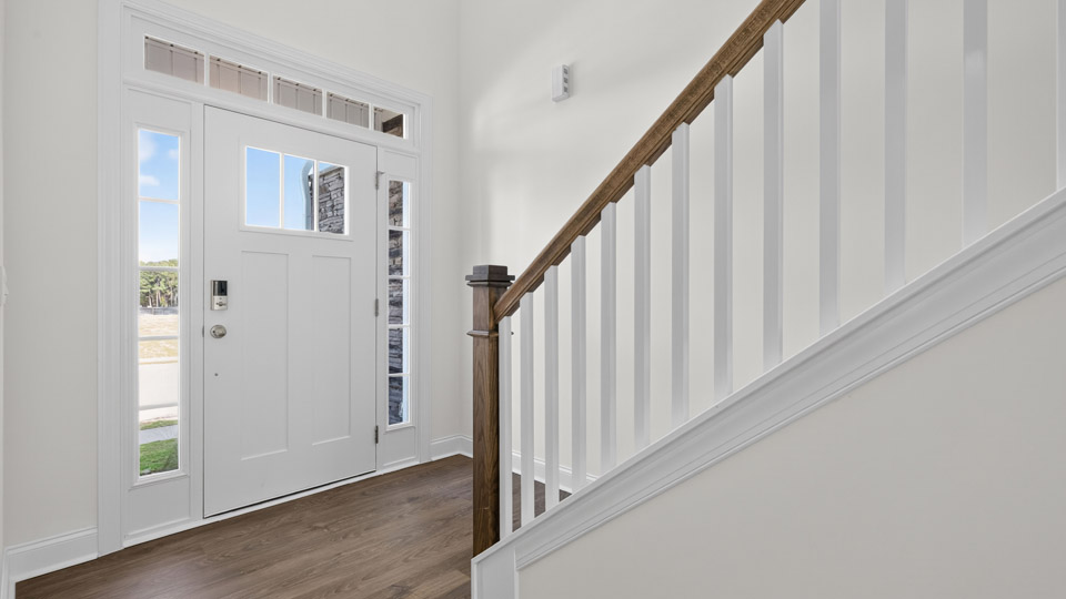 entryway with open rail stairs