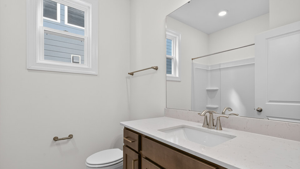bathroom with quartz countertops