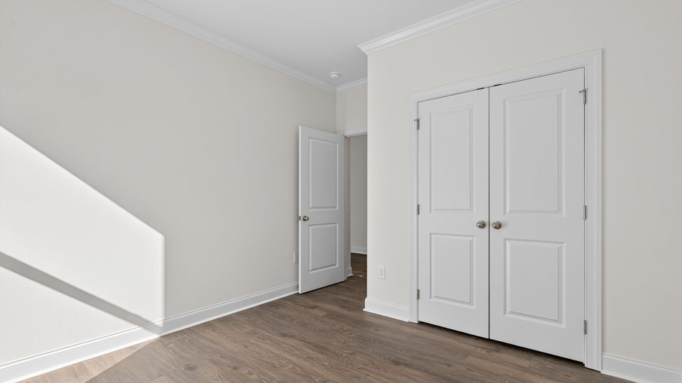 bedroom with revwood flooring