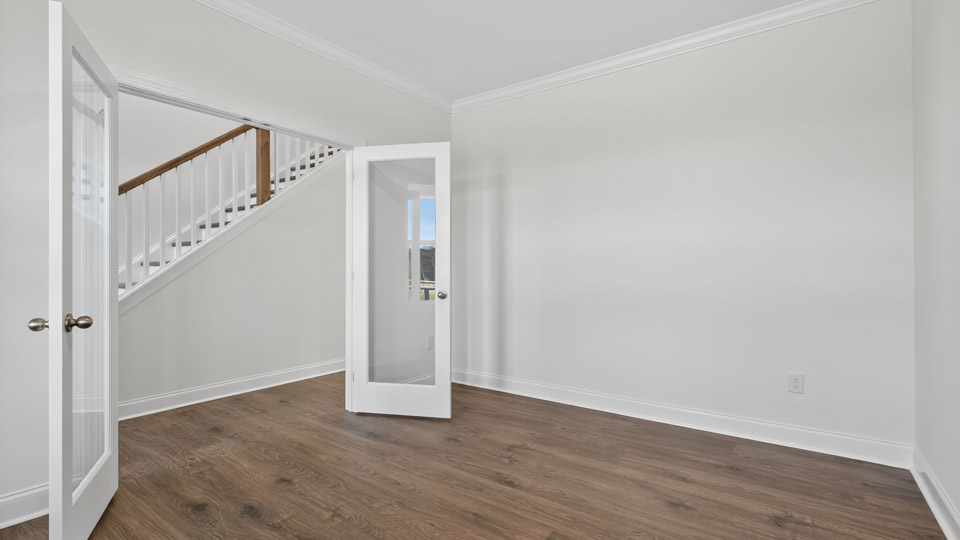 study with revwood flooring and french doors