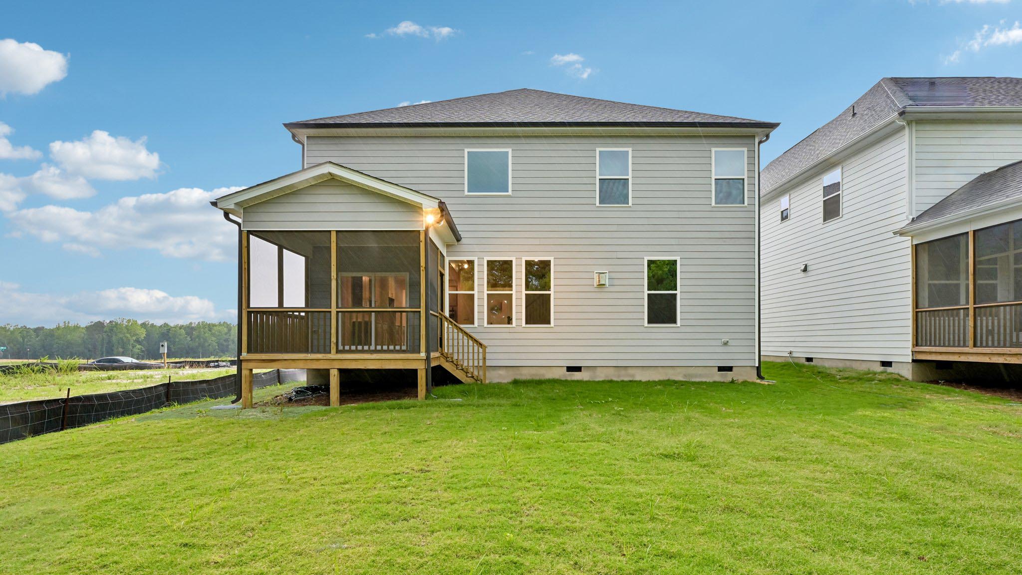 back of summit with covered and screened back deck