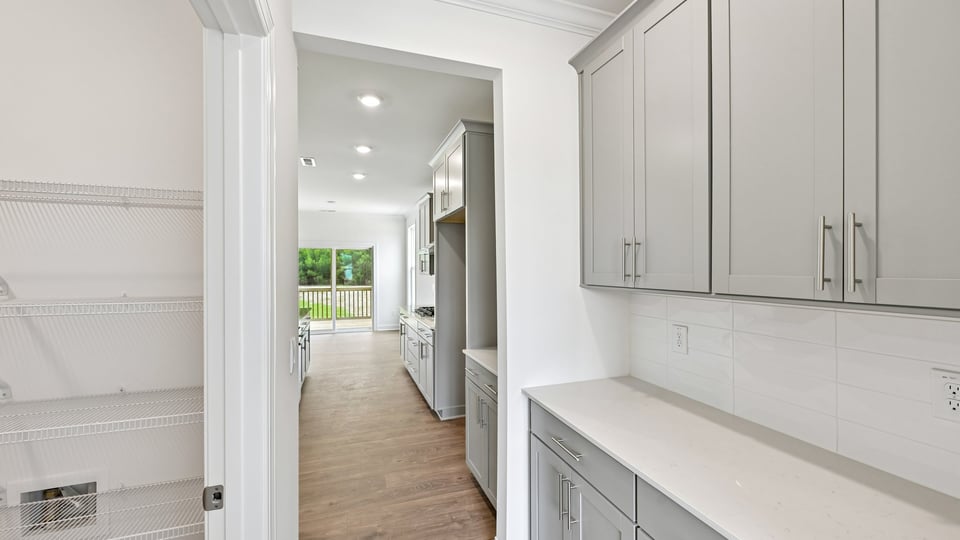 butlers pantry with quartz countertops