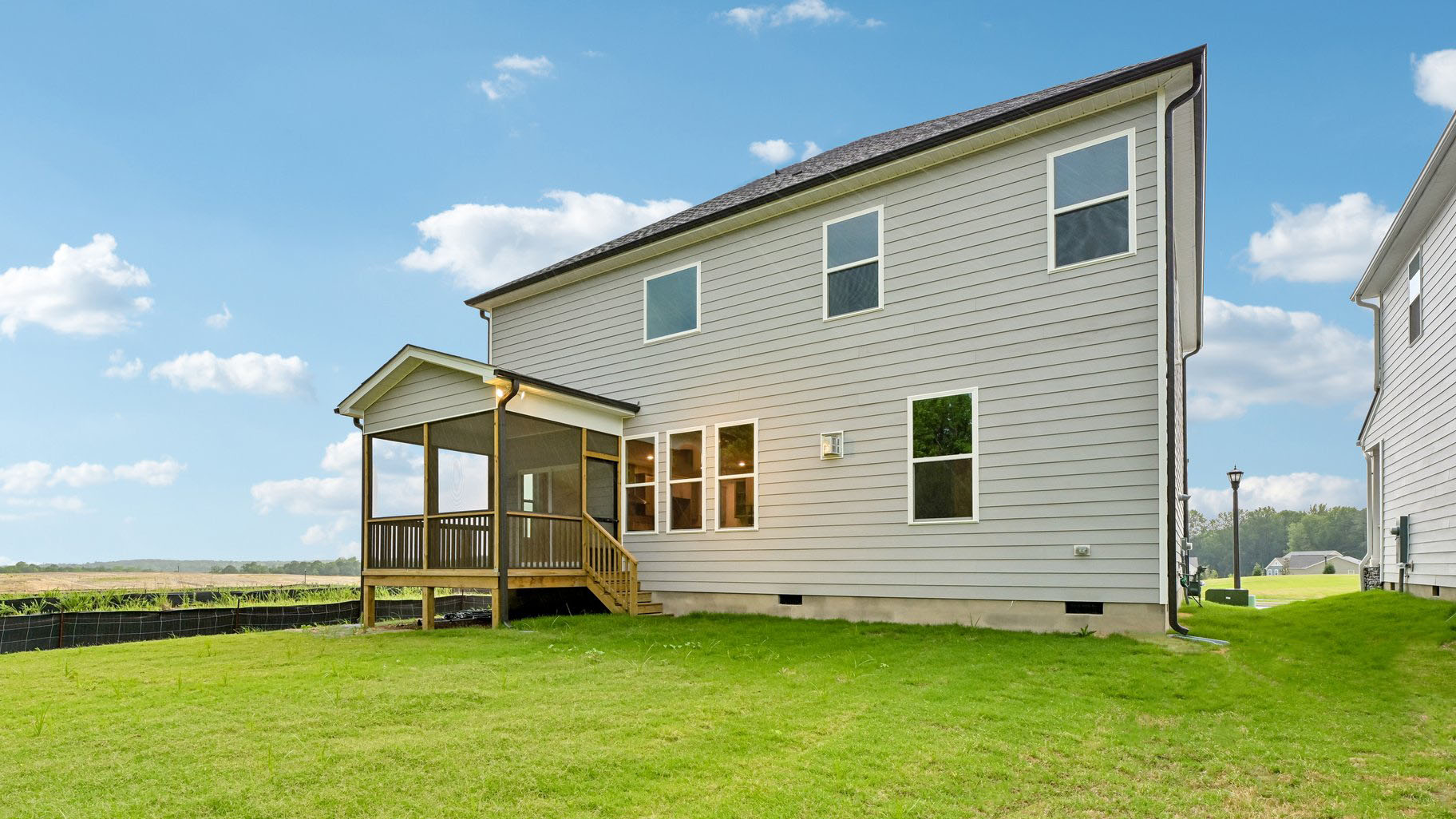 back of summit with covered and screened back porch