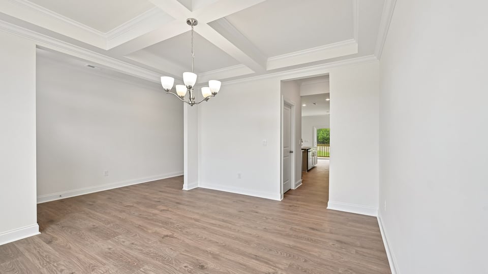dining room with coffered ceiling