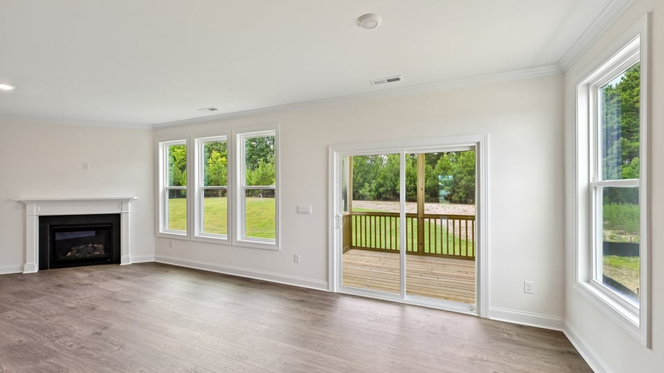 living room with fireplace and lots of natural lighting