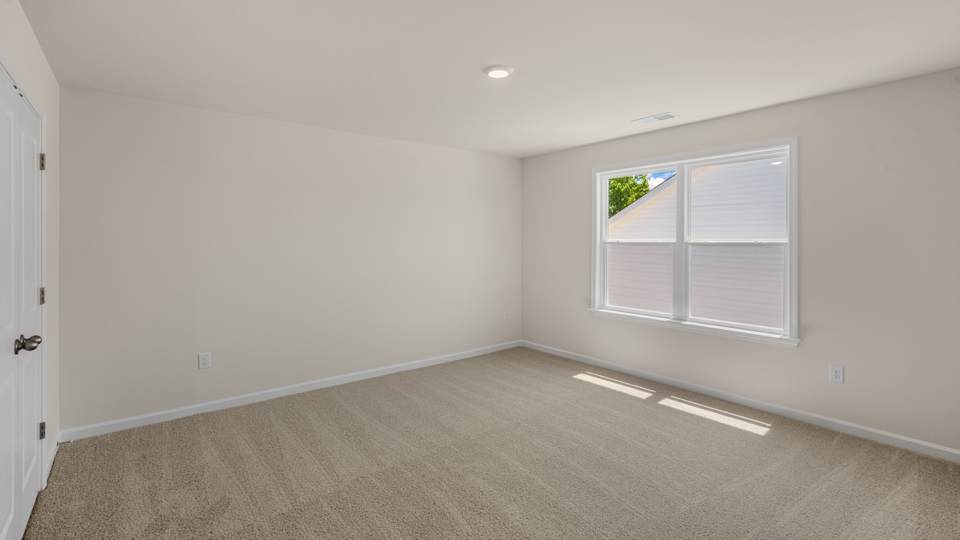 Bedroom with carpet flooring