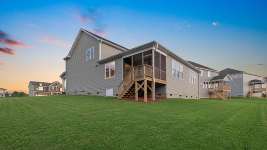 hartwell backyard at twilight with covered back deck