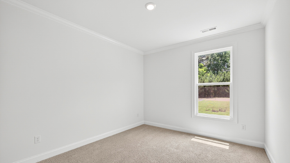 additional bedroom with window, carpeting, closet