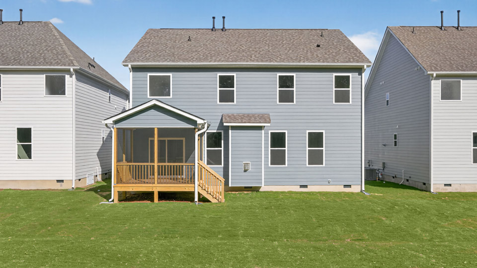 backyard with covered and screened back deck