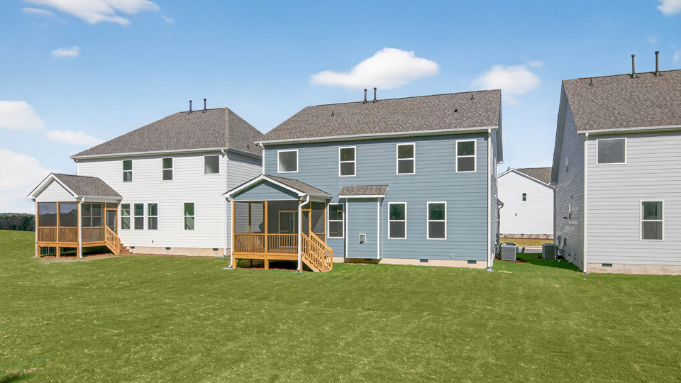backyard with covered and screened back deck