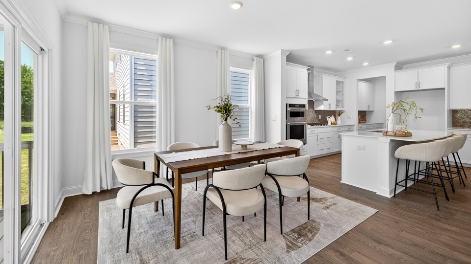 open concept dining space with sliding glass door to patio