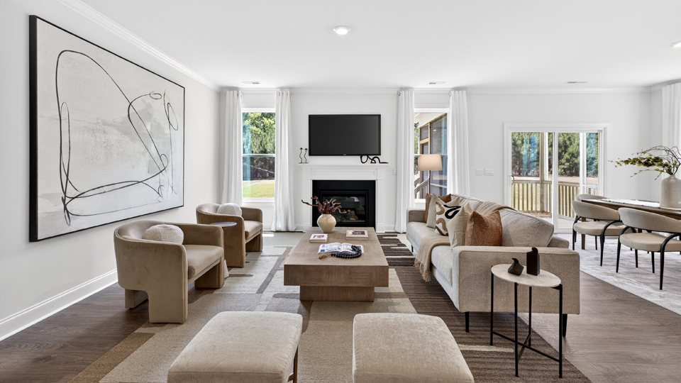 open concept living space with large windows, fireplace