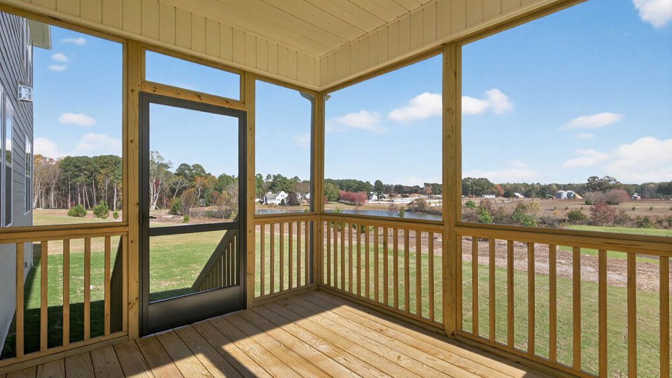 covered and screened back deck