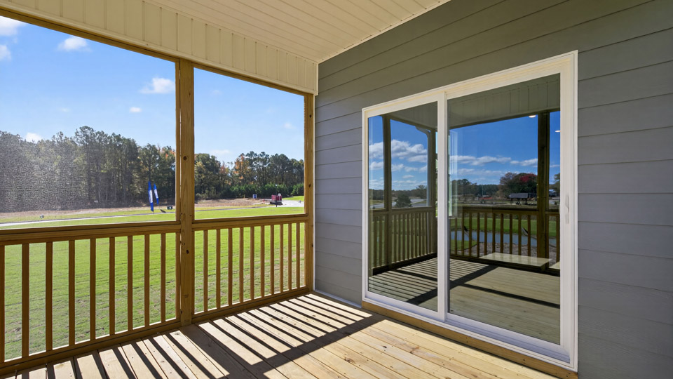 covered and screened in back deck with sliding glass doors