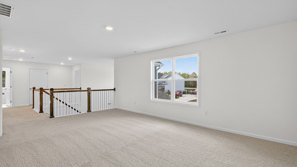 loft with carpet flooring