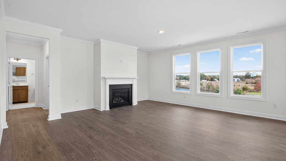 living room with fireplace and revwood flooring