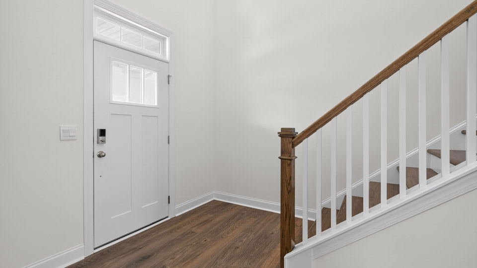 foyer with open-rail staircase