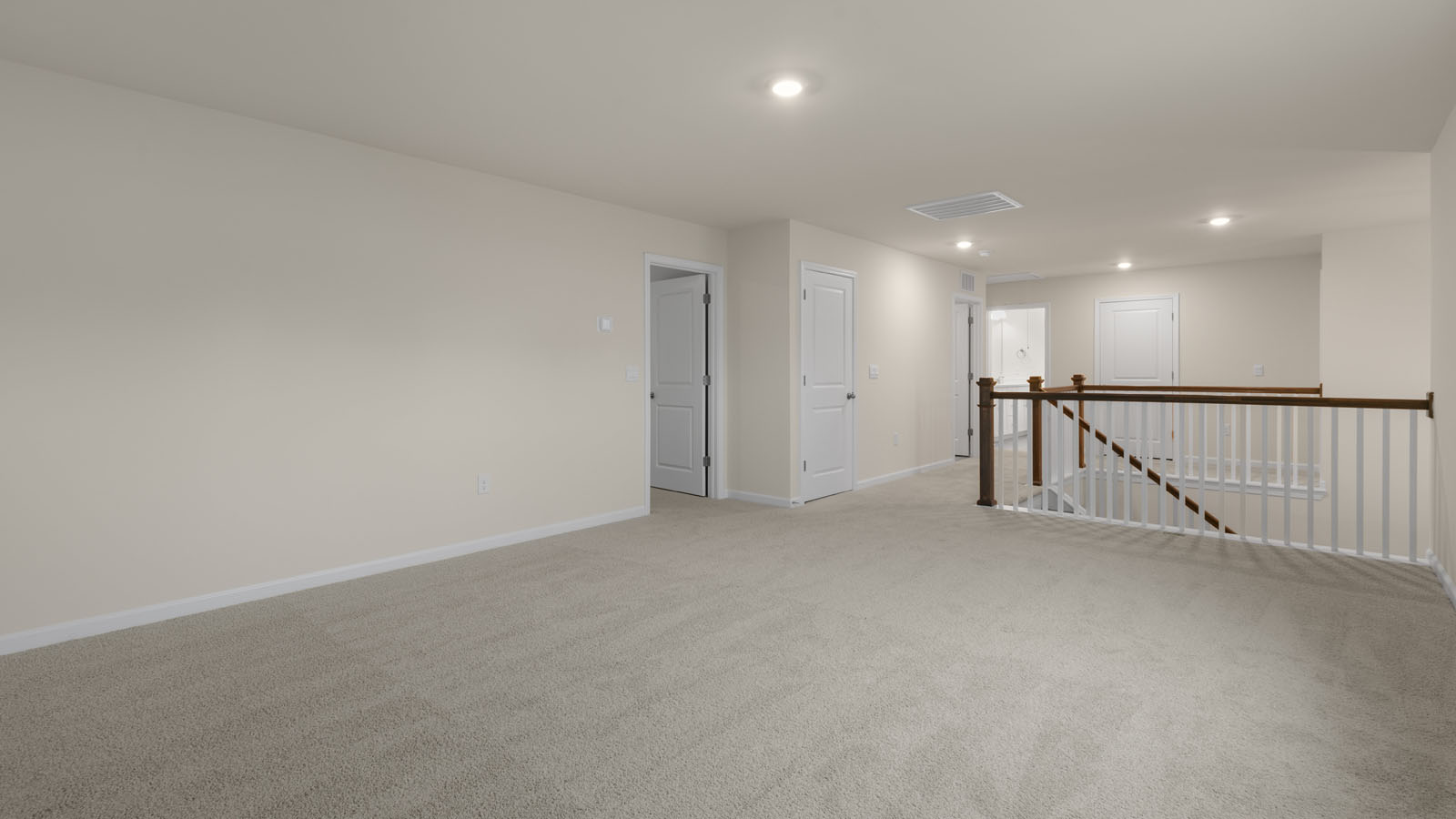 Loft area with carpet flooring