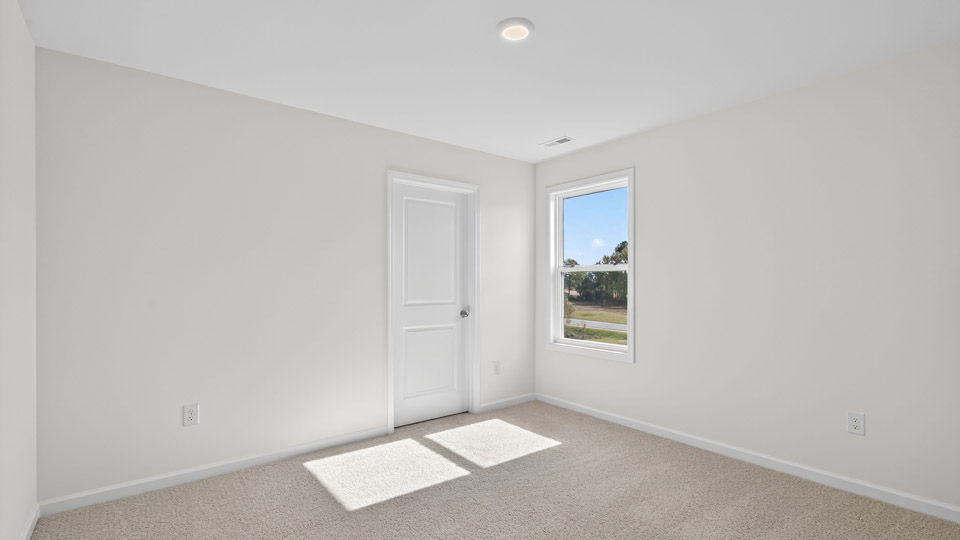 additional bedroom with window, carpeting, closet