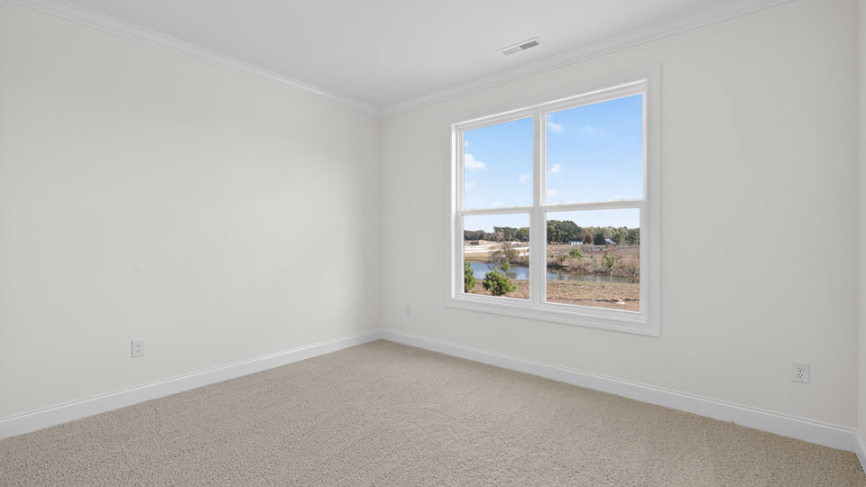 additional bedroom with window, carpeting, closet
