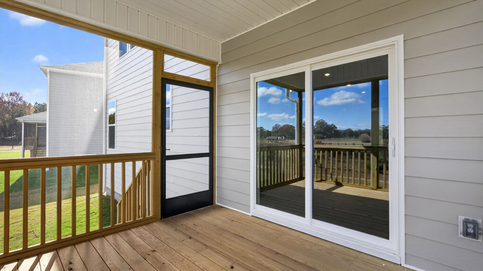 covered and screened inback deck with sliding glass doors