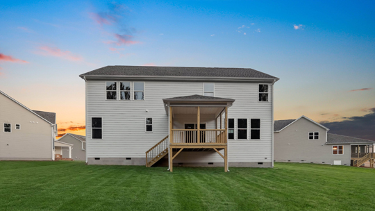 norman backyard with covered back deck at twilight