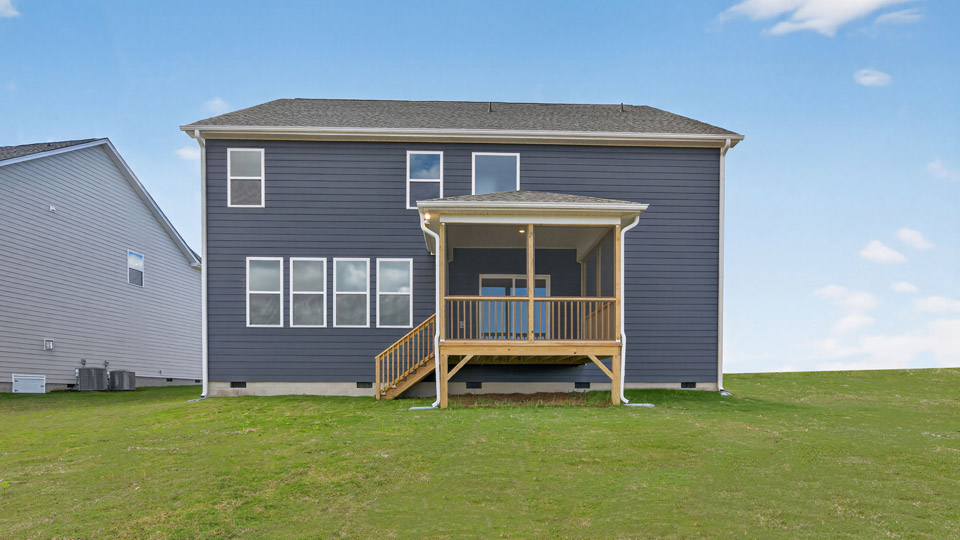 spacious backyard with covered and screened back deck