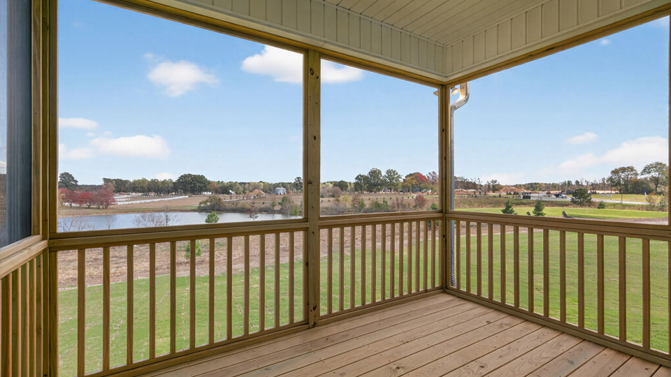 covered and screened in back deck overlooking spacious backyard