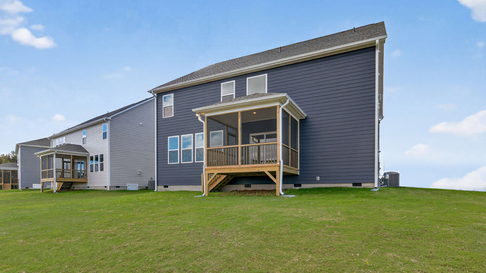 spacious backyard with covered and screened back deck