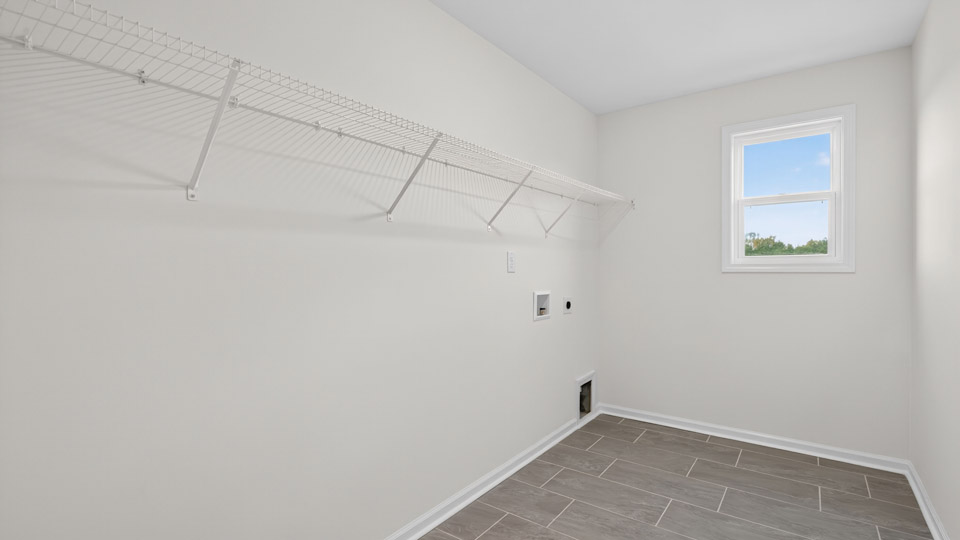 walk-in closet with wire shelving and window for natural lighting
