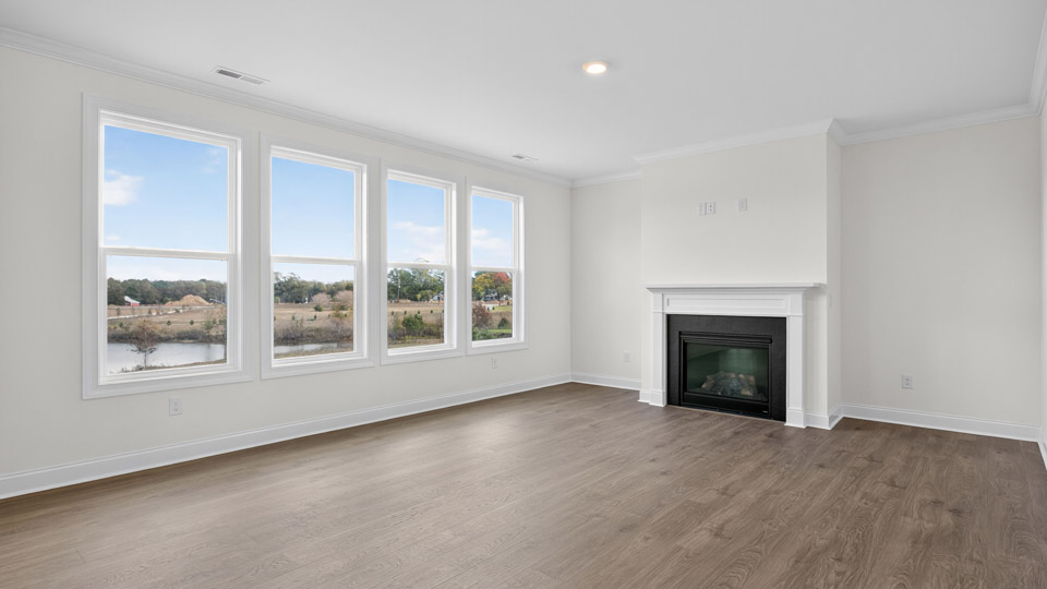 living room with revwood flooring and fireplace