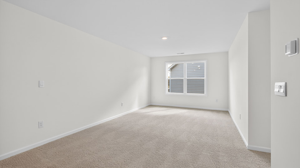 loft with carpet flooring