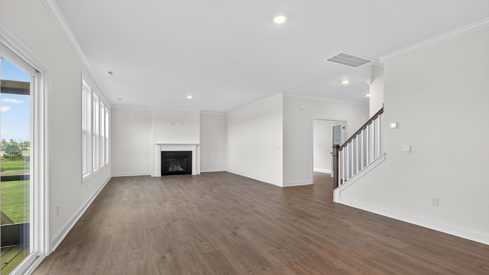 living room with revwood flooring and fireplace