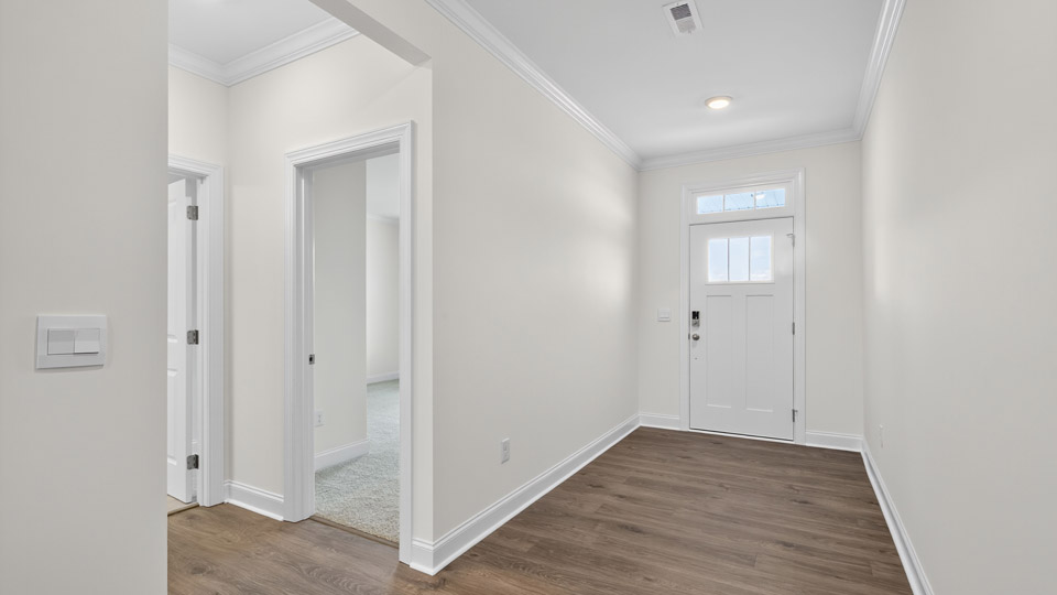 foyer entryway with revwood flooring
