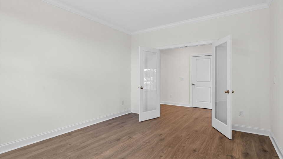 study with revwood flooring and french glass doors