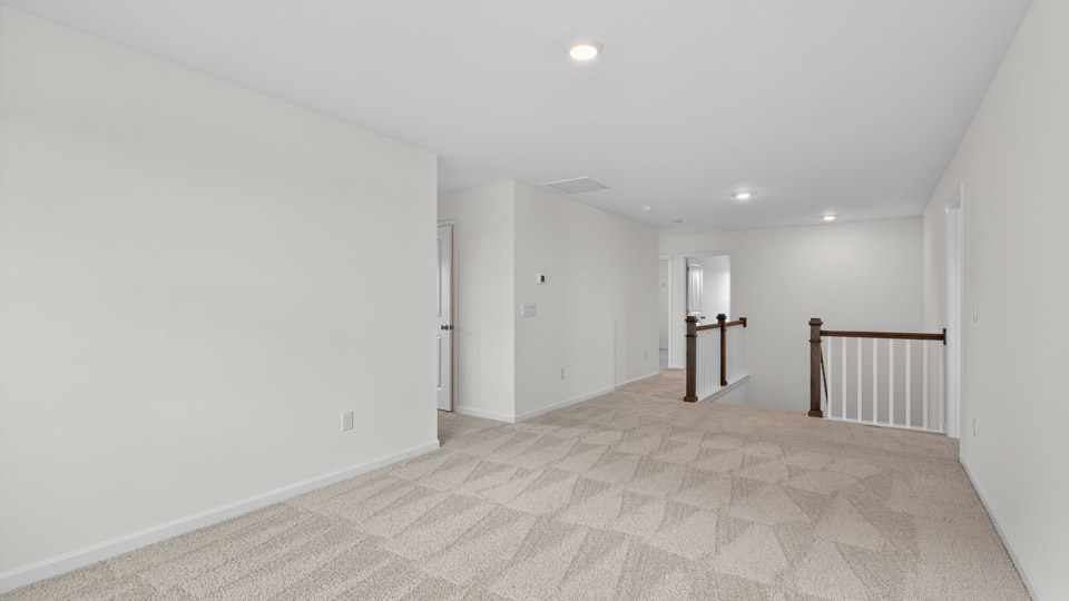 loft with carpet flooring