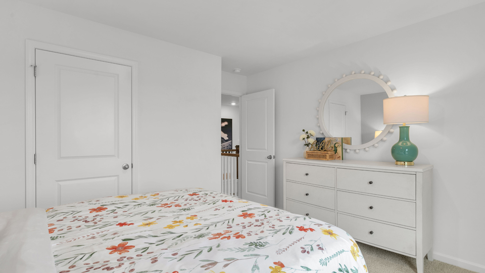 additional bedroom with window, carpeting, closet