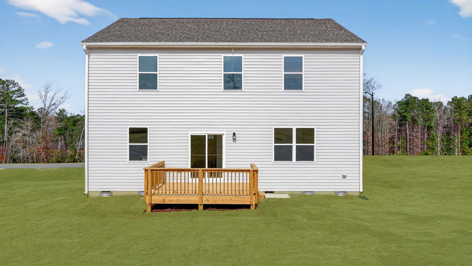 back exterior with deck and open yard
