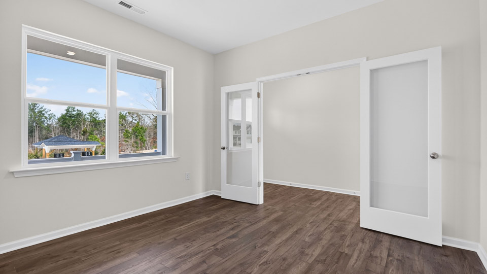Study room with hardwood floors and big windows