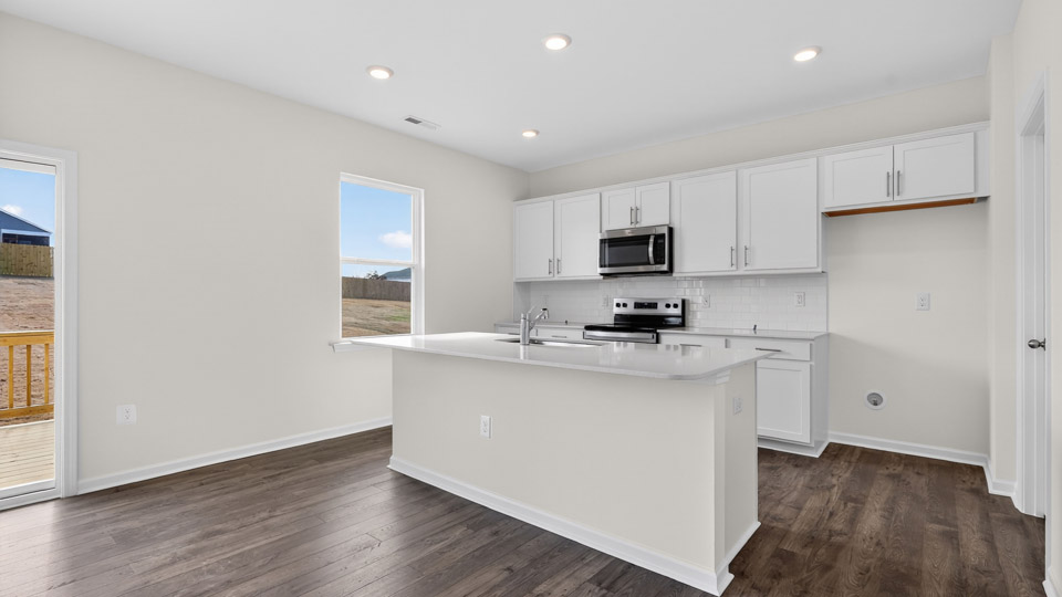 Kitchen with white cabinets and stainless steel appliances.