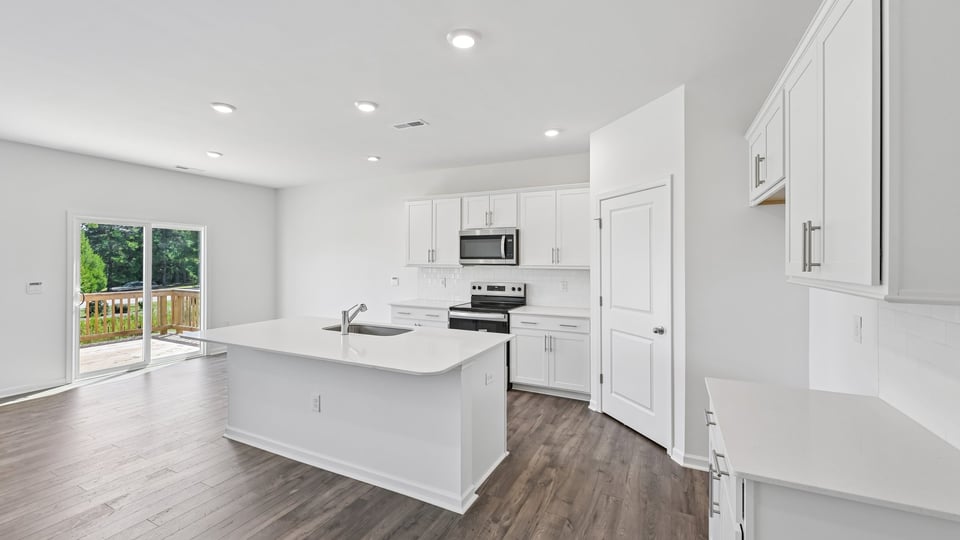 kitchen with white cabinets quartz countertops and center island