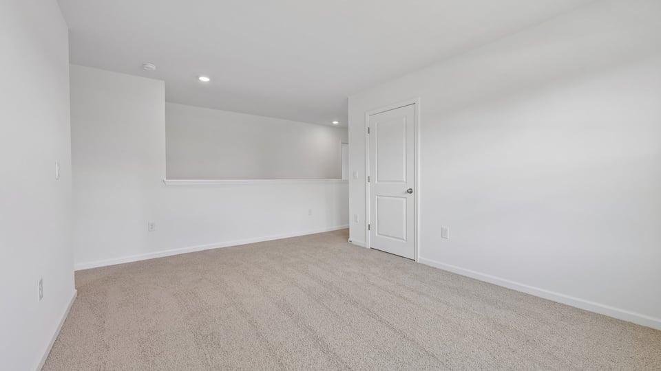 loft with carpet flooring