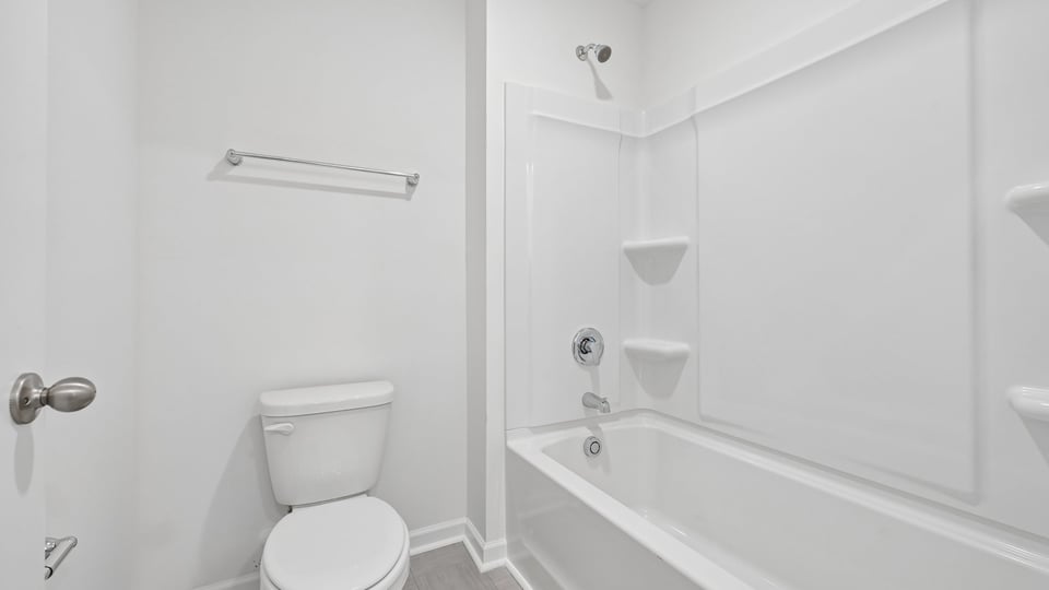 bathroom with tub shower combo