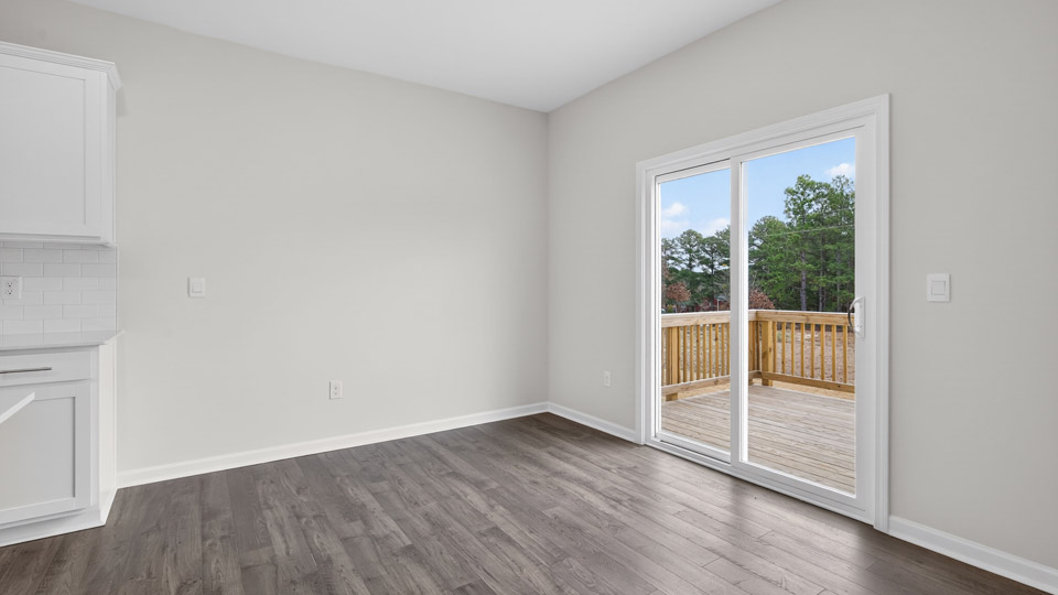 open concept dining space with door to patio