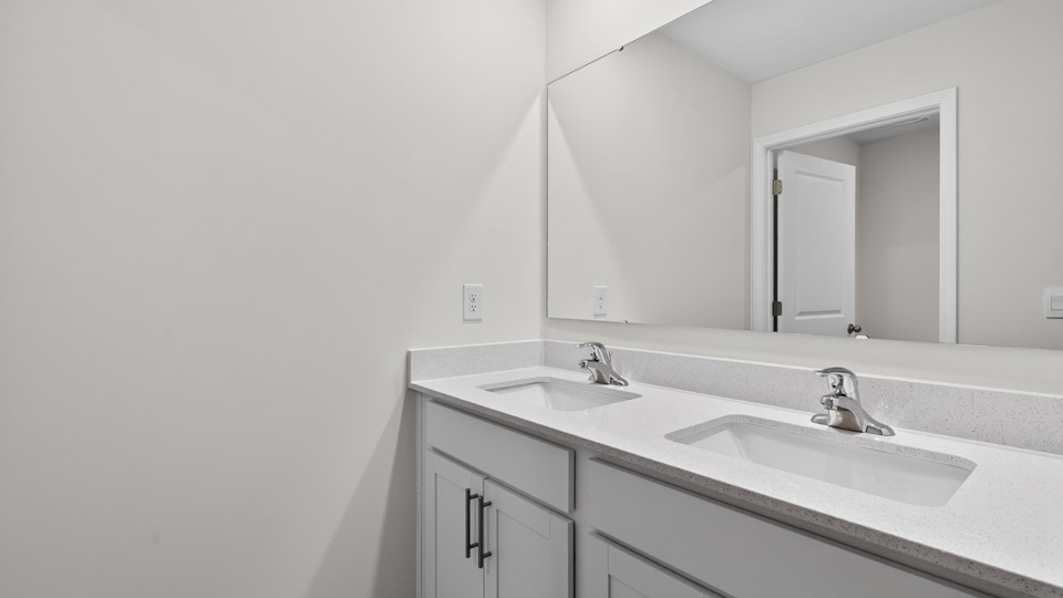 additional bathroom with double vanity sink