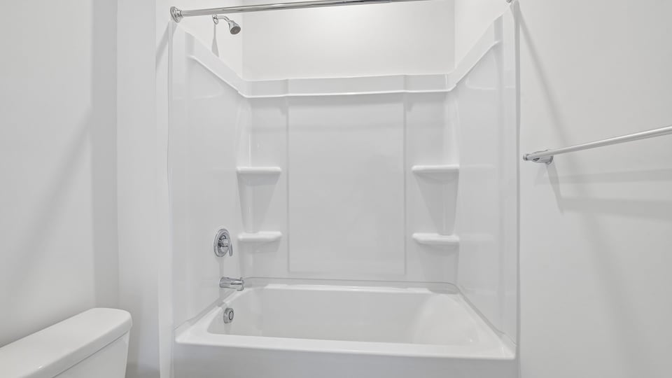 bathroom with tub shower combo